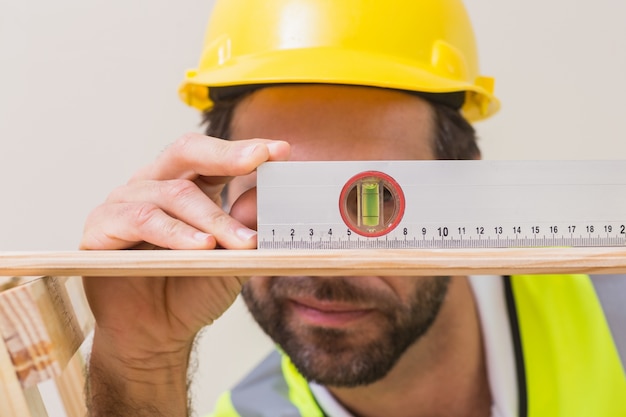 Construction worker using spirit level