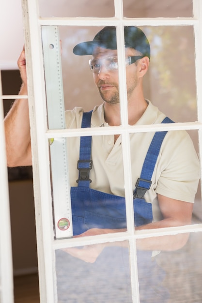 Photo construction worker using spirit level