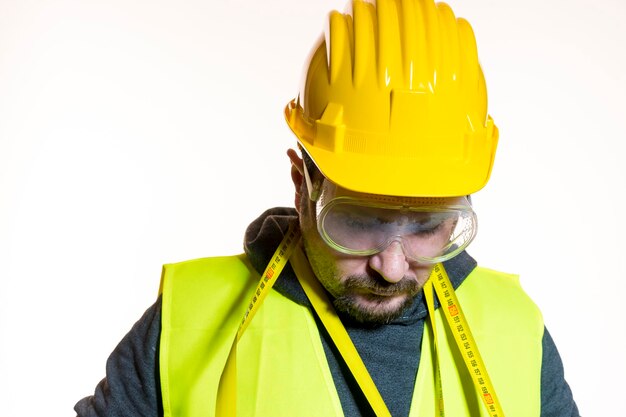 Photo construction worker wearing hardhat against white background