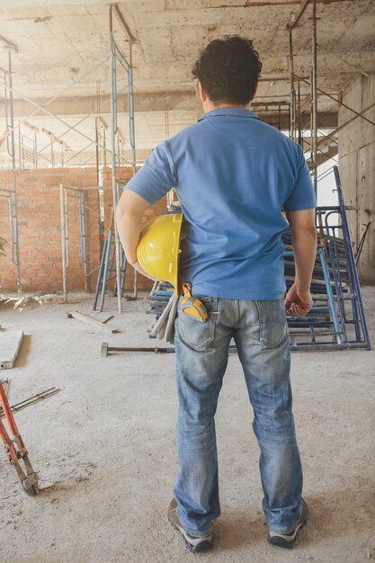 Construction Worker with helmet in building construction site