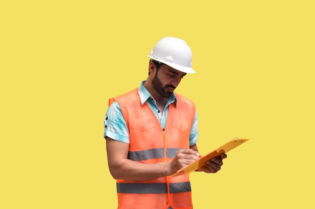 construction worker writing on clipboard indian pakistani model