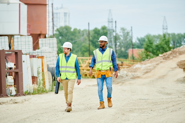 Construction Workers Crossing Site