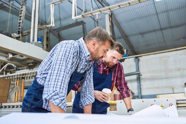 Construction Workers Discussing Plans