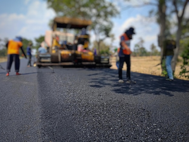 Photo construction workers working on road