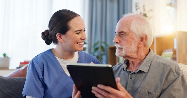 consultation nurse and senior man with tablet on couch for results and healthcare in home happy caregiver and technology in living room for retirement internet or online app for medical support
