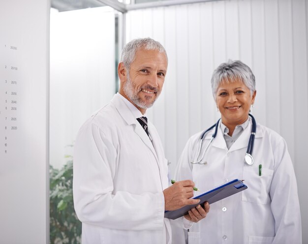 Consulting a colleague for a second opinion Shot of two doctors working together in a hospital