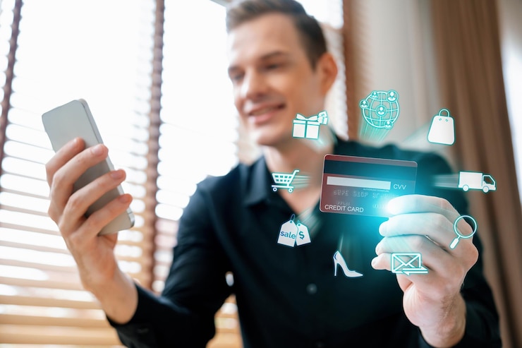 Photo consumer holding credit card using device shopping online inventory cybercash