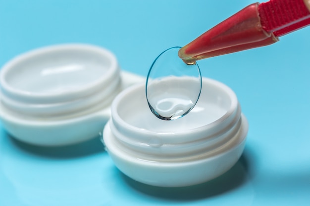 Photo contact lens, contact lens case, tweezers