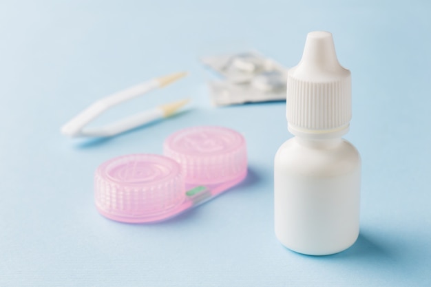 Contact lenses, tweezers and a container for storing lenses