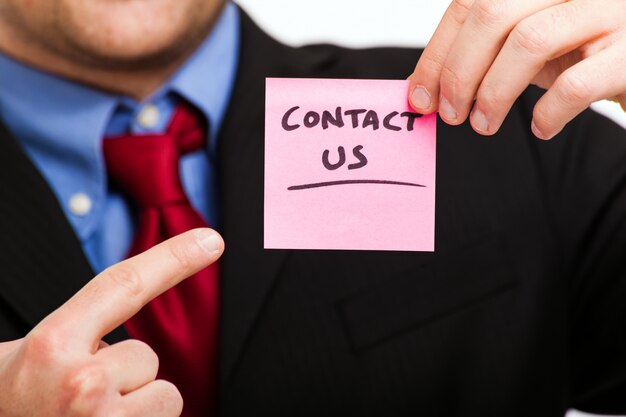 Contact us concept, businessman holding a sticker