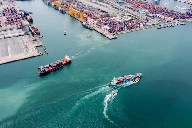 Container cargo ship sailing in green sea to transport of goods import export