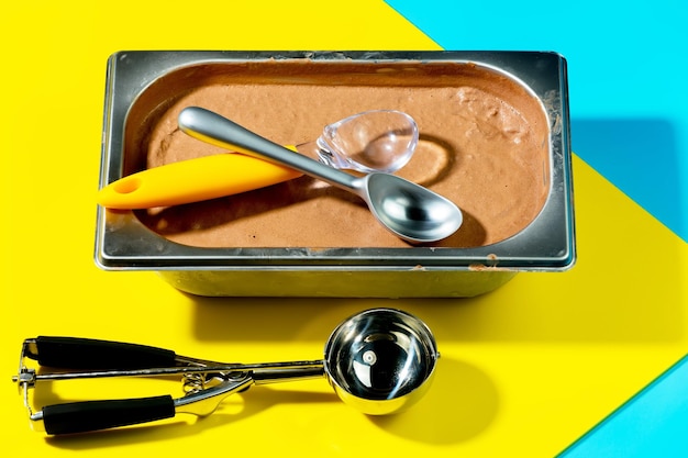 A container of ice cream with a spoon in it