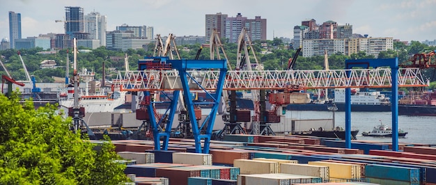 Container ship in import export and business logistic By crane Trade Port Shipping cargo to harbor Aerial view from drone International transportation Business logistics concept