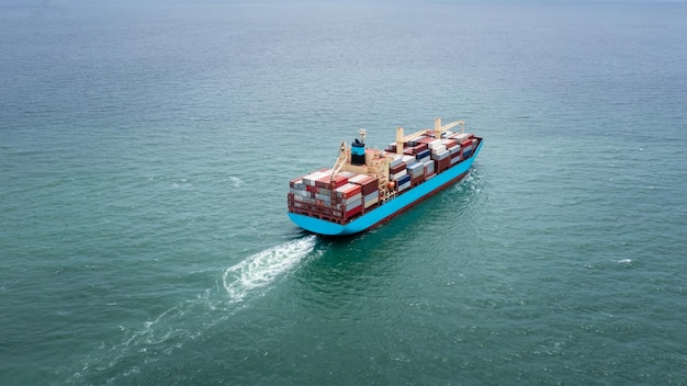 container ship to import export marine goods to dealers and consumers across the pacific and around the world businesses and industries Ocean freight forwarding aerial view