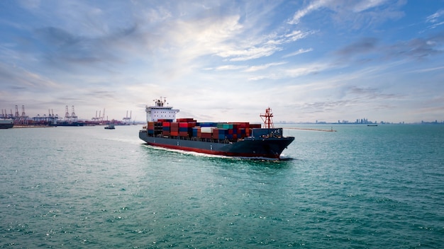 Container ship transporting large cargo logistic import export goods