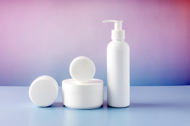 Containers for cosmetics on a color gradient background