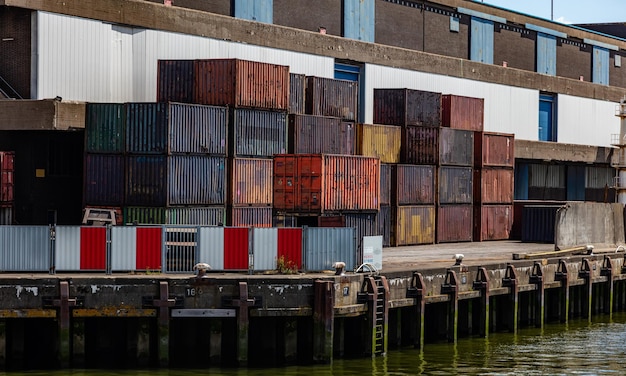 Containers old rusted at harbor of Rotterdam Netherlands Logistics business cargo loading unloading