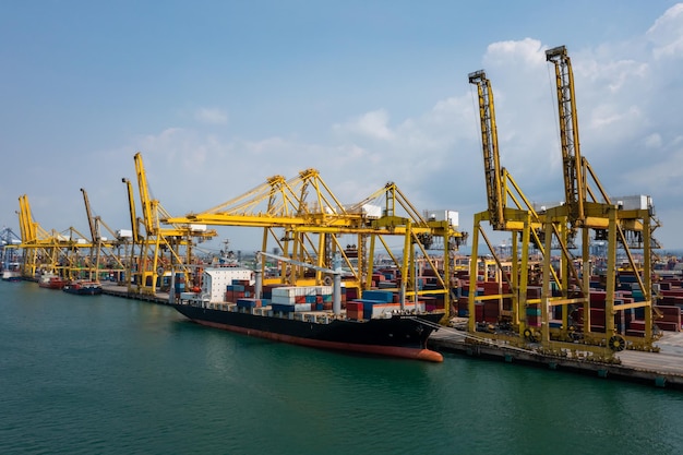 Containers ship and shipping ports logistic freight load\
unloading by crane forwarding industry