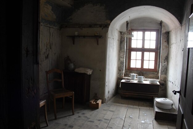 Photo containers on table by window in old house