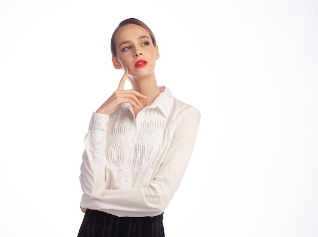 Photo contemplative young business woman in white shirt isolated on white background