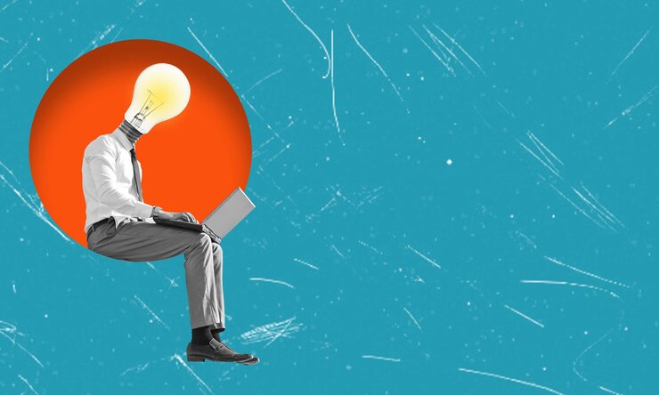 फोटो contemporary art collage depicting a man led by a light bulb sitting on in a circle with a laptop