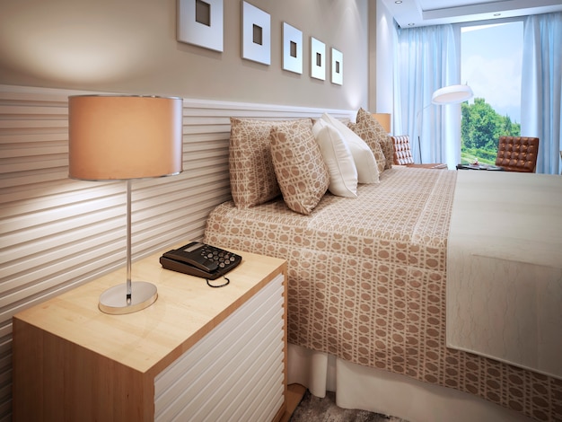 Contemporary bedroom design and bed with cushions and table lamp with brown shade.