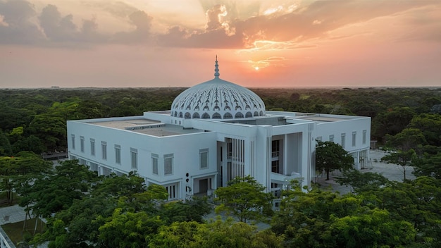 Contemporary Mosque A Fusion of White Tranquility and Green Serenity Amidst Natures Canopy Sunset D