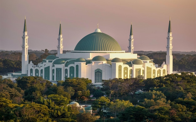 Contemporary Mosque A Fusion of White Tranquility and Green Serenity Amidst Natures Canopy Sunset D