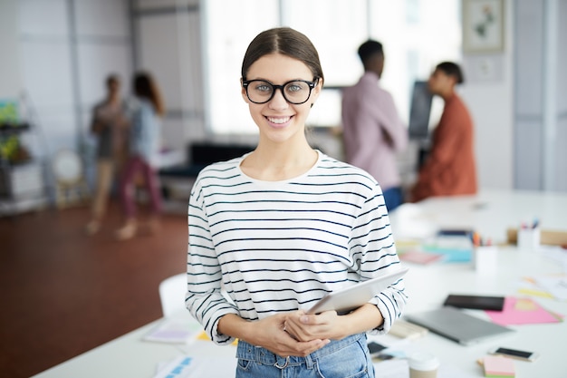 Contemporary Young Businesswoman Smiling at Camera