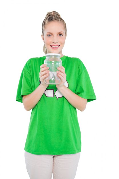 Content blonde activist holding glass jar