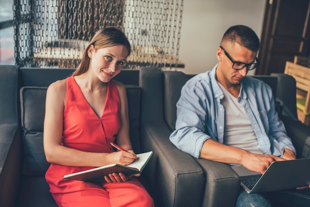 Content couple concentrating on work at home