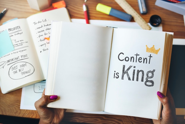 Photo content is king written on a book