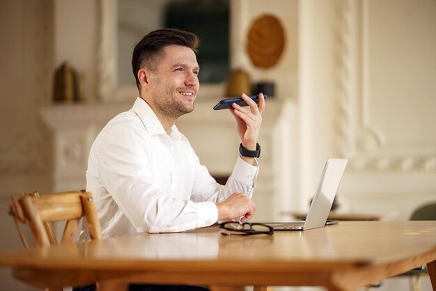 A contented man in a serene state lying back with white headphones enveloped in the tranquil