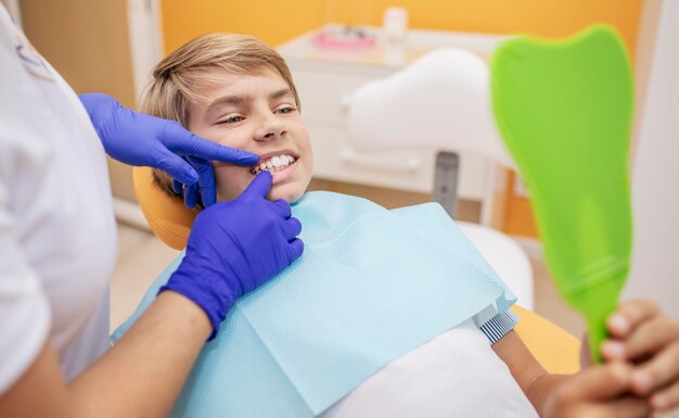 Contented teenage patient looking at his