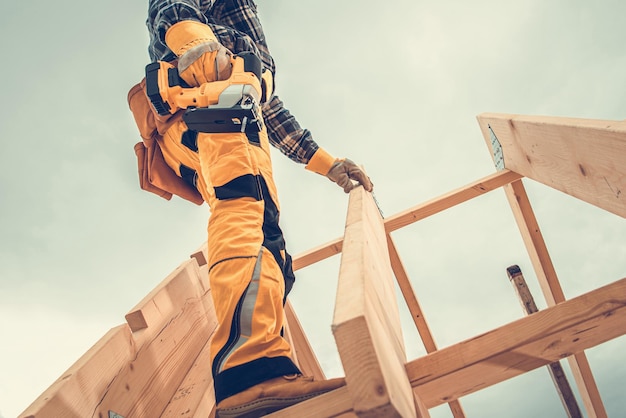 Contractor Finishing Wooden Skeleton House Frame