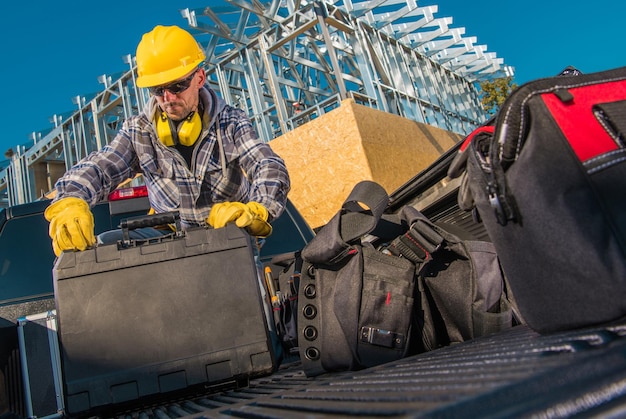 Contractor packing up his tools after finished work