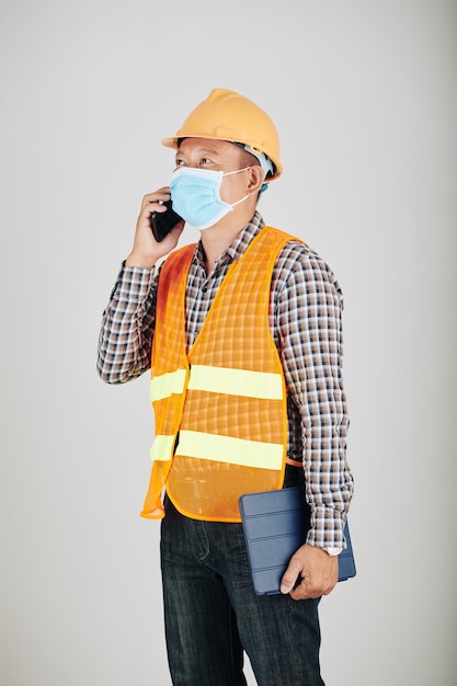 Contractor talking on phone