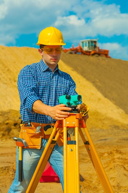 A contractor with theodolite