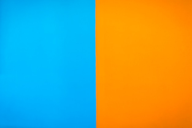 Contrast painted blue and orange color wall background