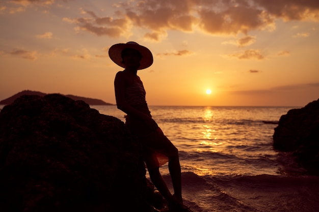 Contrast silhouette of young slender woman