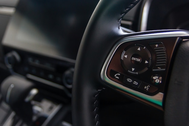 Control buttons on steering wheel, Car interior.