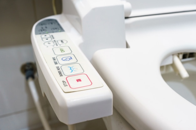 Control Panel of the toilet bowl, automatic modern flush toilet.