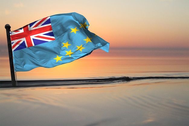 a contry of tuvalu national flag on a see backgrund