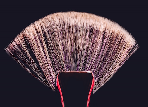 Conturing makeup brush on black background