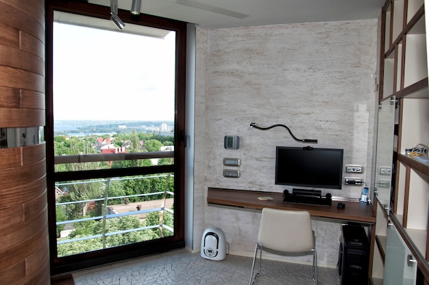 Convenient, compact workplace with a computer on the table in a modern interior