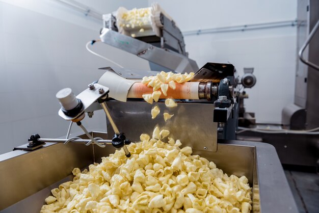 Conveyor line for packing snacks and chips in a modern factory