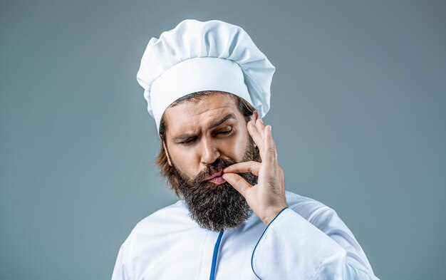Cook hat Professional chef man showing sign for delicious Chef cook making tasty delicious gesture by kissing fingers Bearded chef cooks or baker Bearded male chefs isolated on white perfect