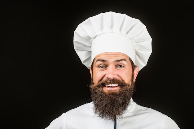 Cook hoed. Bebaarde chef-kok, koks of bakker. Bebaarde mannelijke chef-koks geïsoleerd op zwart.