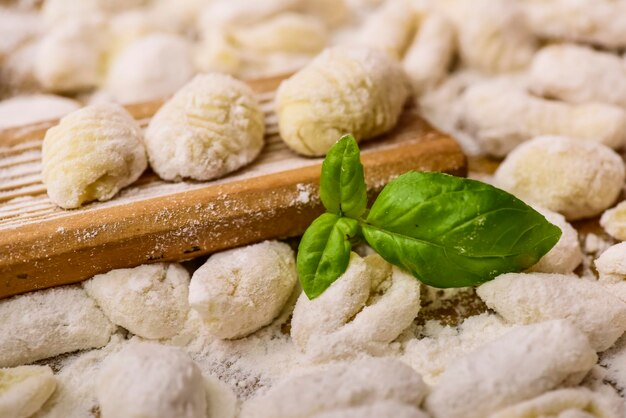 Cook homemade gnocchi on the table Italian tradition