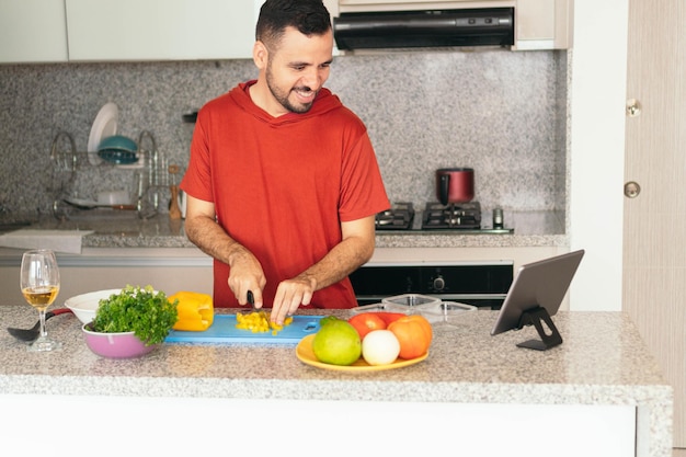 Cook making a video call while cooking in the house